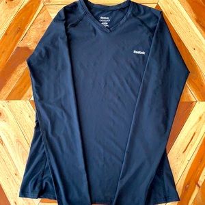 Long-sleeve Reebox athletic top.